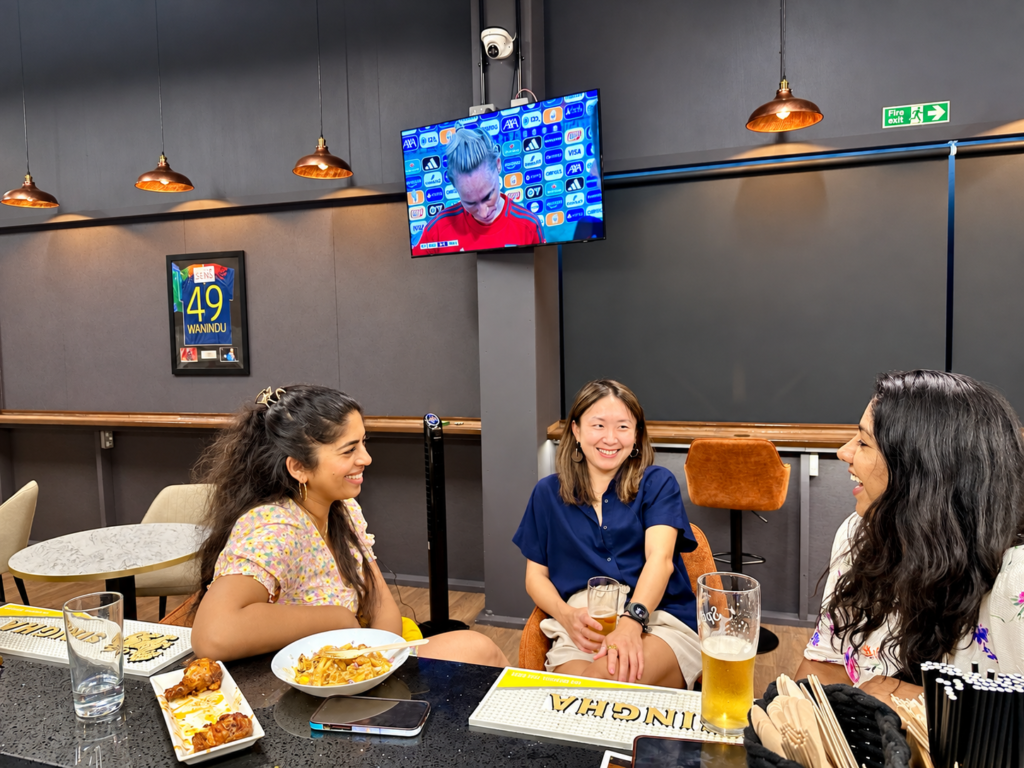 Friends enjoying food and drinks at HPC Players Lounge