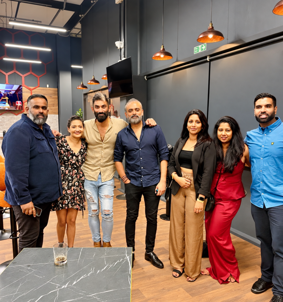 Group of guests posing together at HPC Players Lounge
