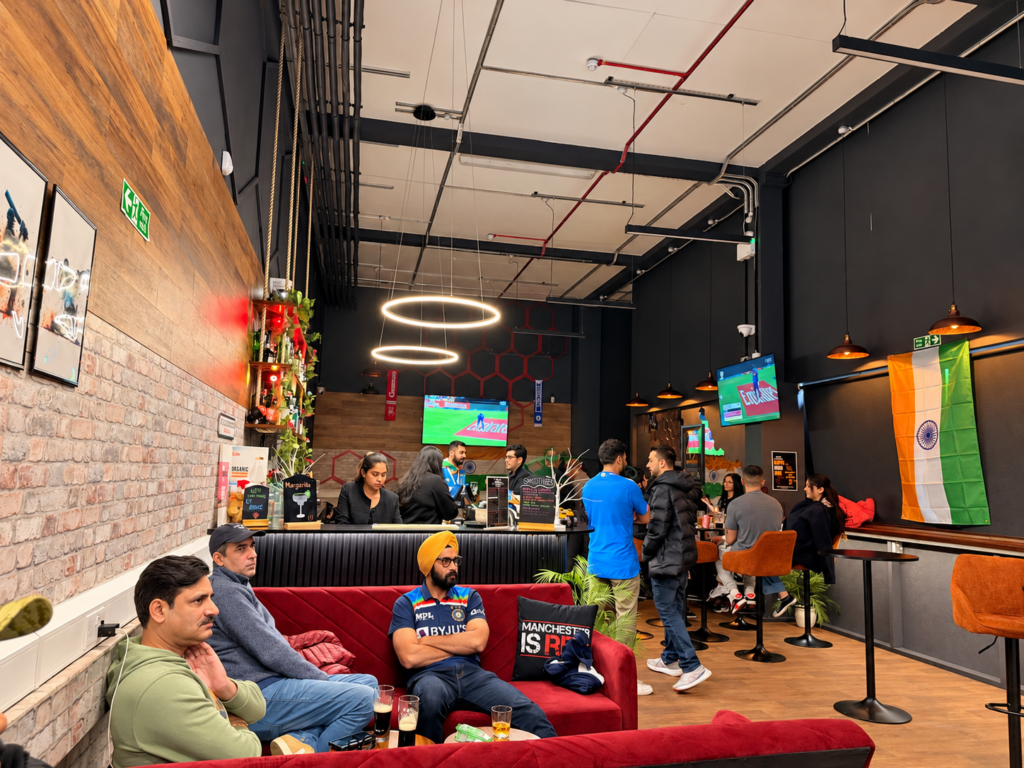 Guests relaxing in the lounge and watching live cricket